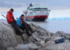 Richard and Andy watch a passing penguin. : Port Lockroy