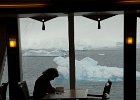 Karen updates her journal in the Bistro. Not a bad view! : Fram