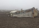 Water boat stranded in the ash. : Whalers Bay